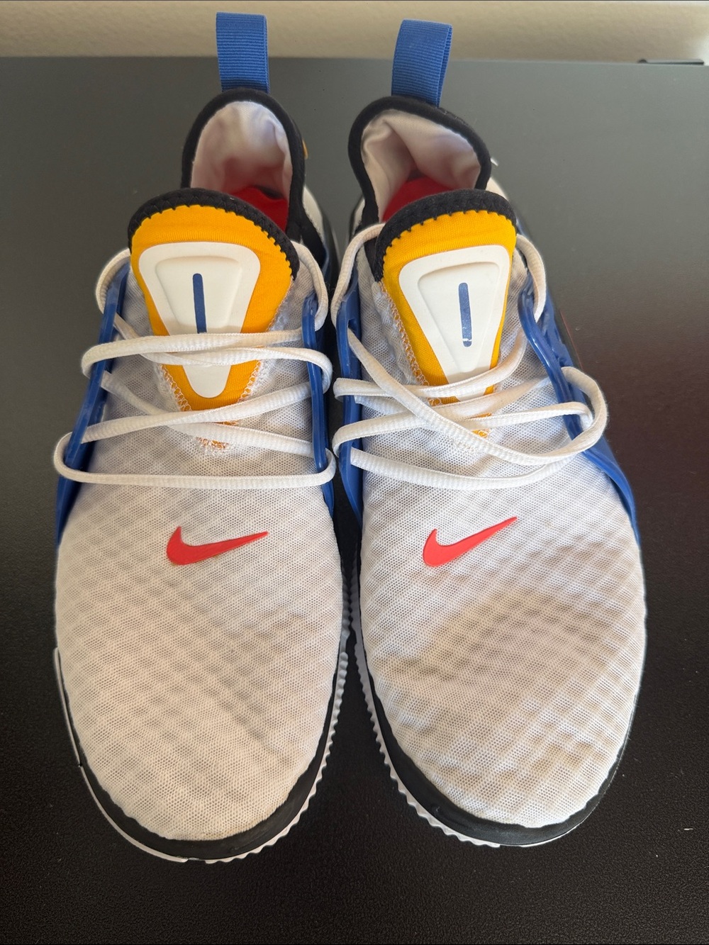 Nike Men's White Sneakers with Blue, Yellow & Red Accents